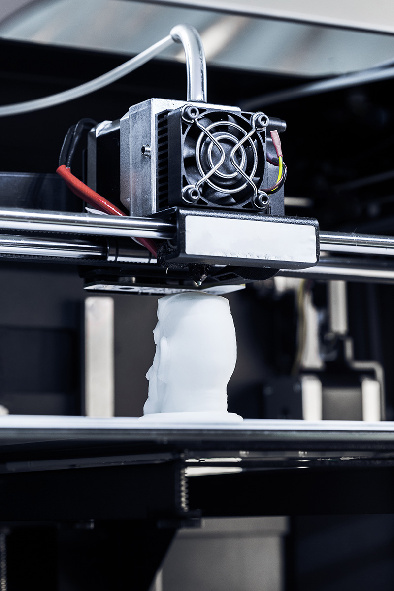 3d printer creates a figure in a workshop during
